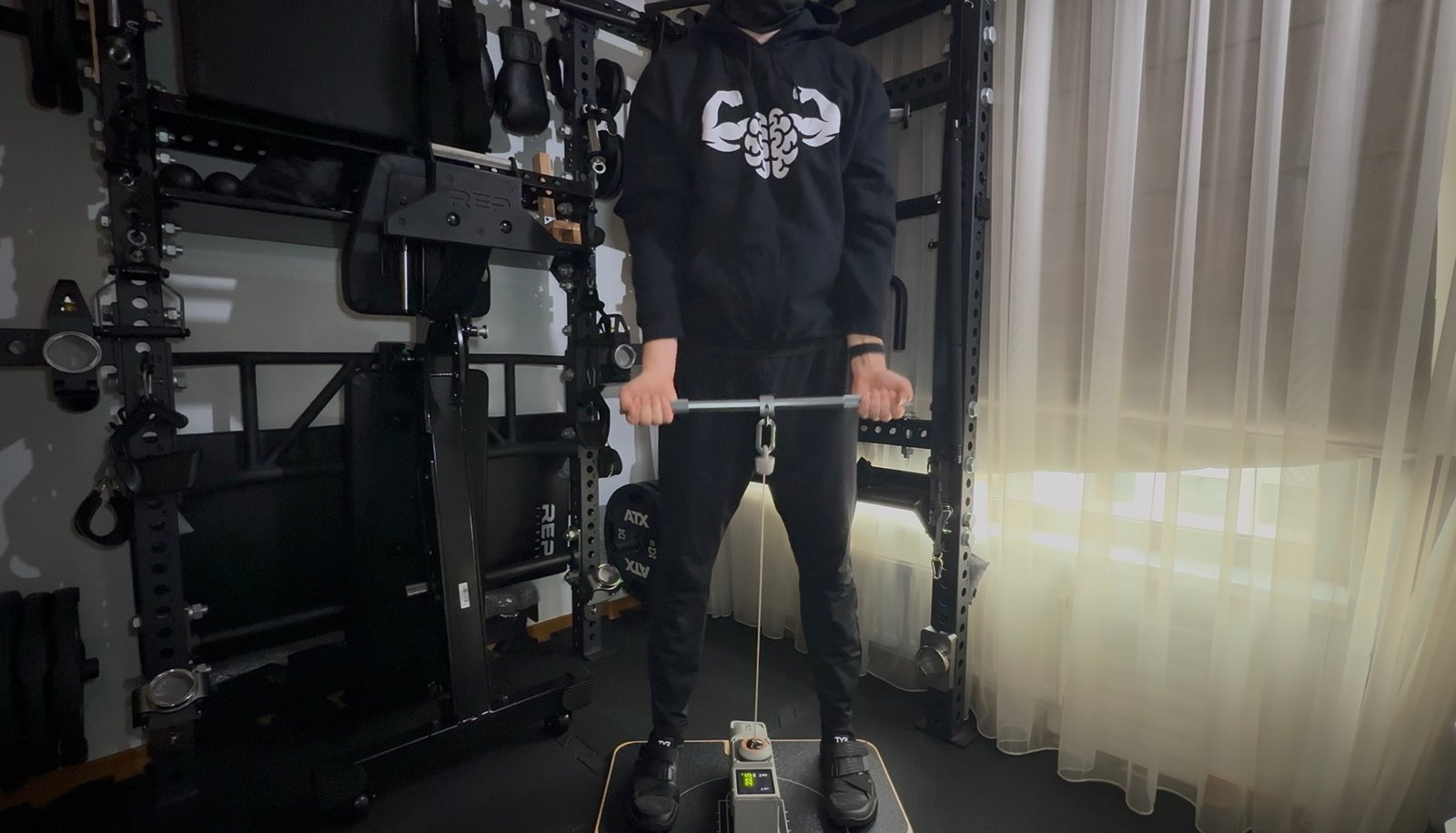 Training with the Beyond Power VOLTRA on its platform in the Mind Muscle Perfection home gym
