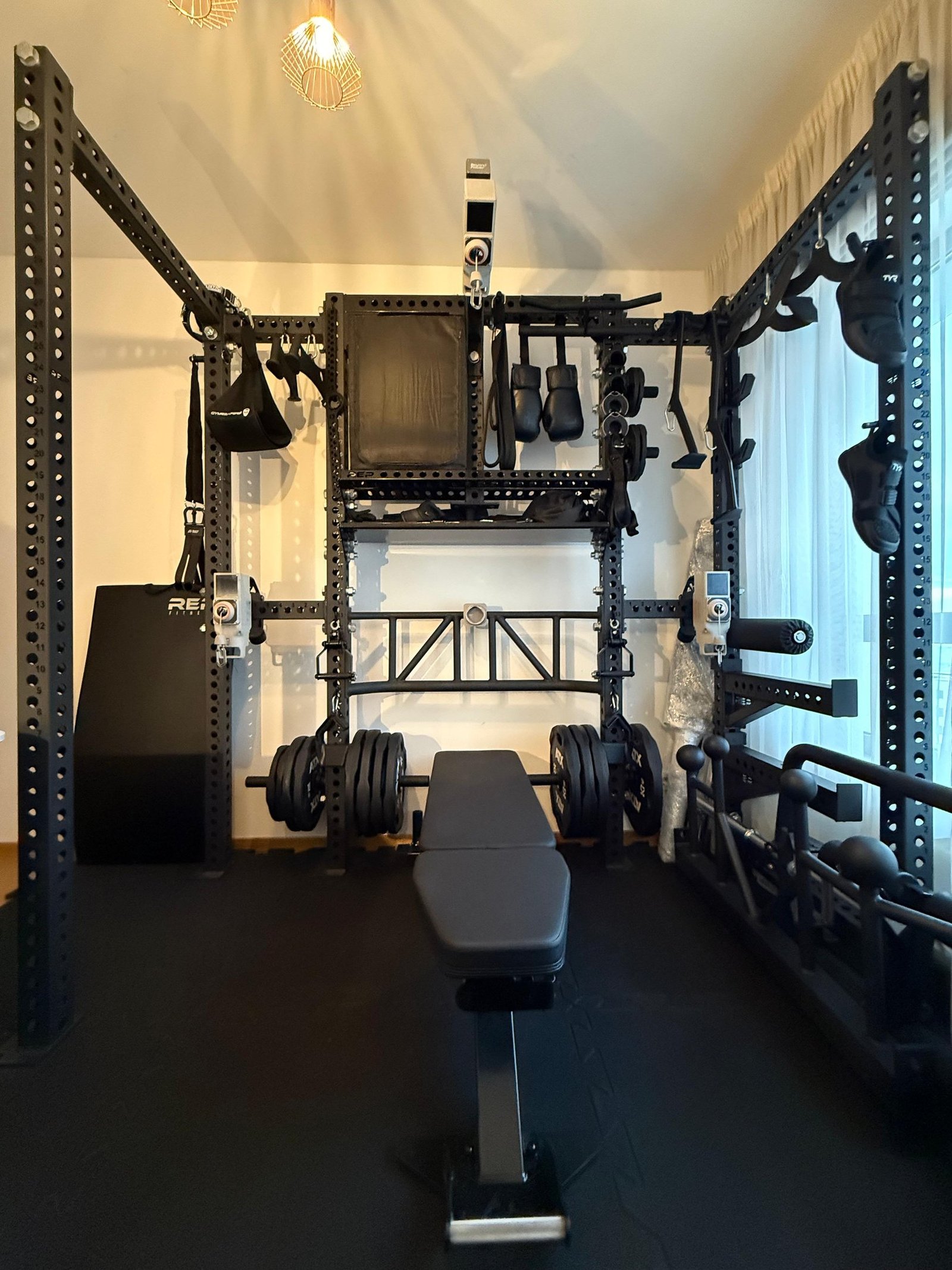 Mind Muscle Perfection compact home gym setup with strength training equipment