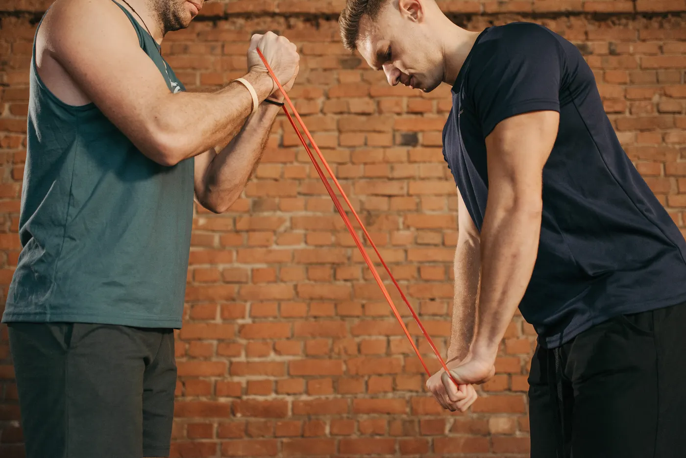 Athlete training with a resistance band and a coach