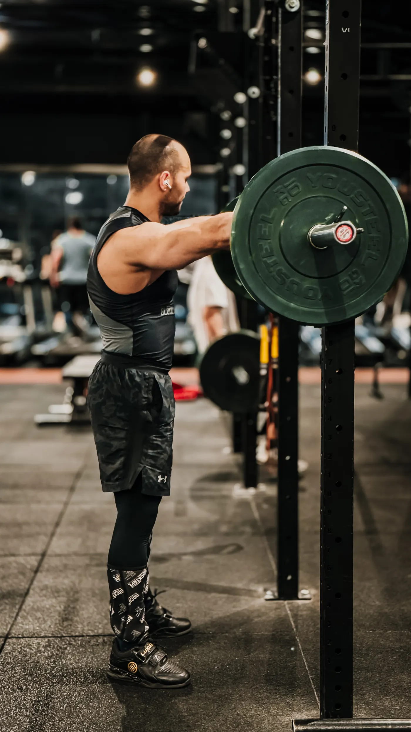 Male athlete lifting a barbell during a gym session