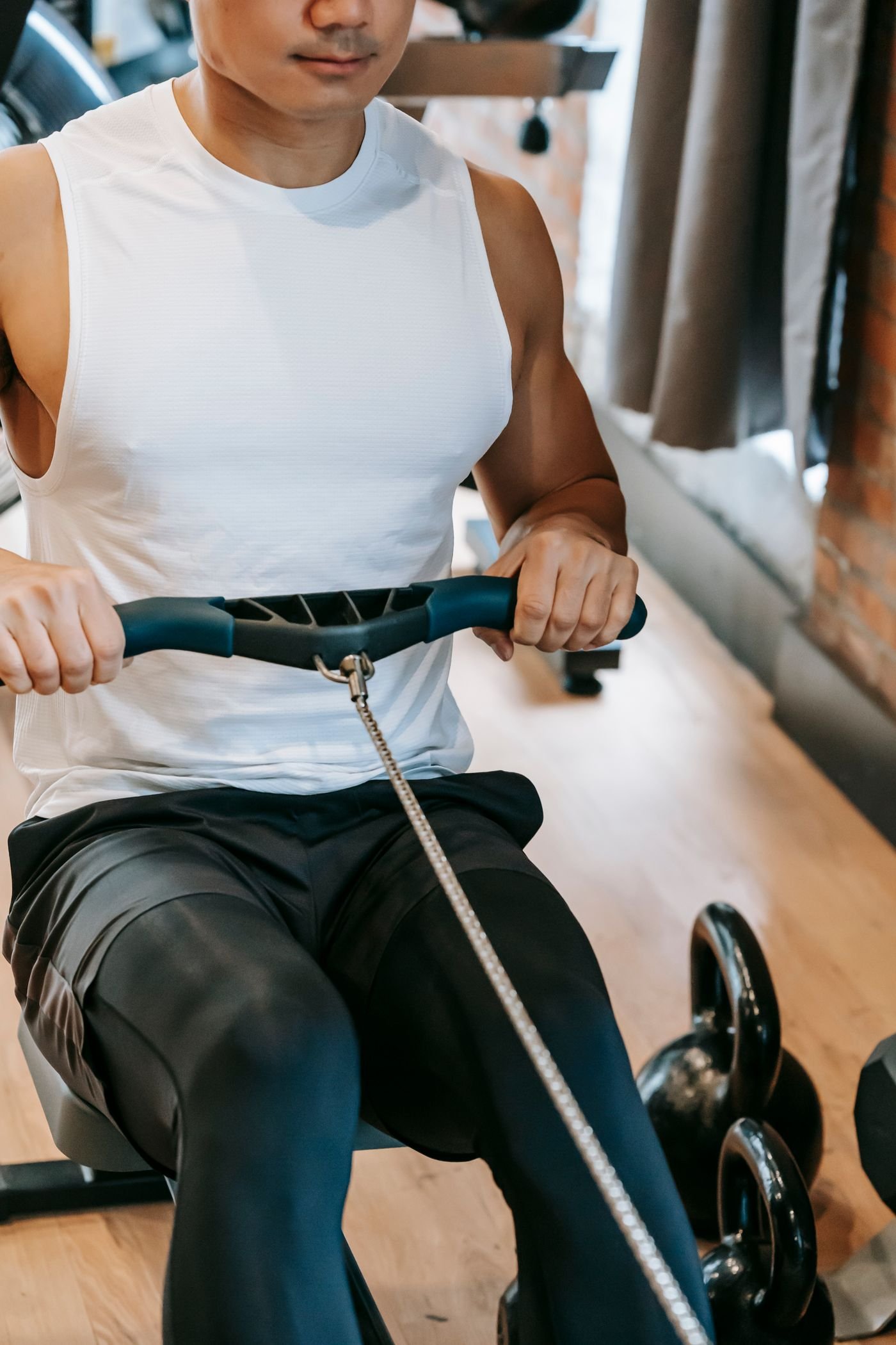 Athlete performing a rowing-machine interval in a gym