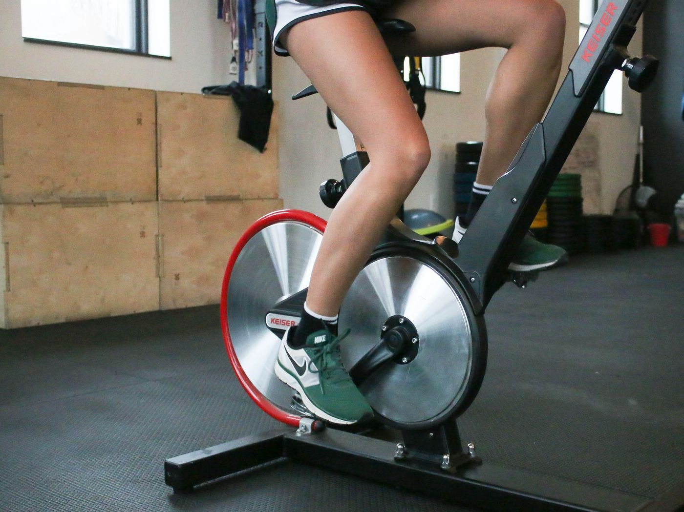 Close-up of legs pedaling a stationary exercise bike