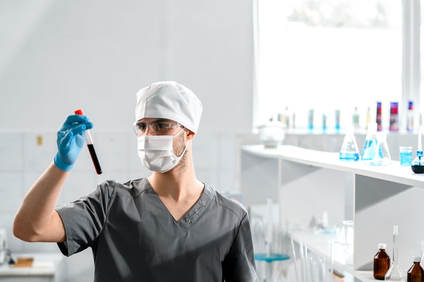 Medical technician examining a blood sample in a laboratory