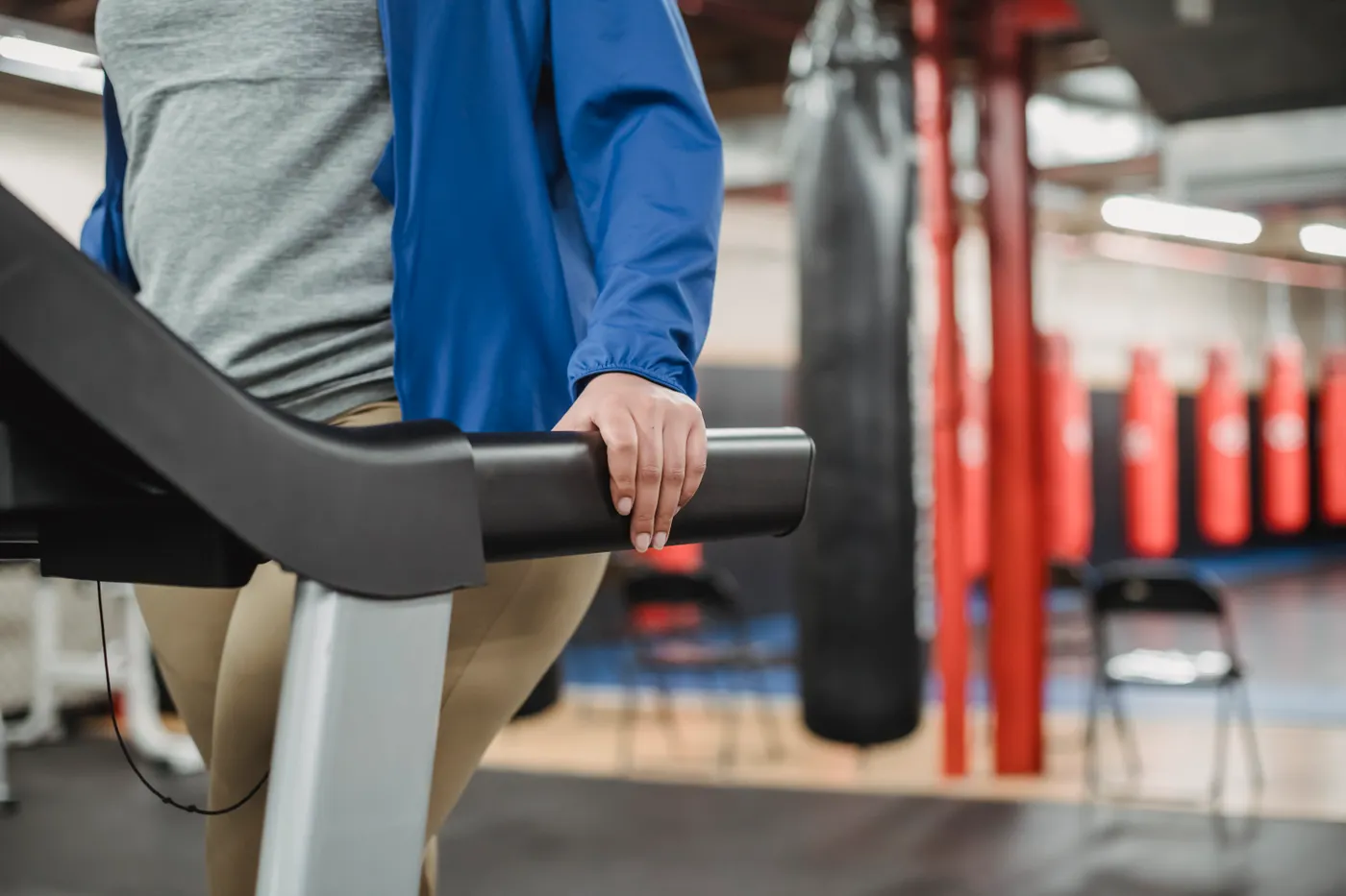 Woman walking on a treadmill during steady aerobic exercise
