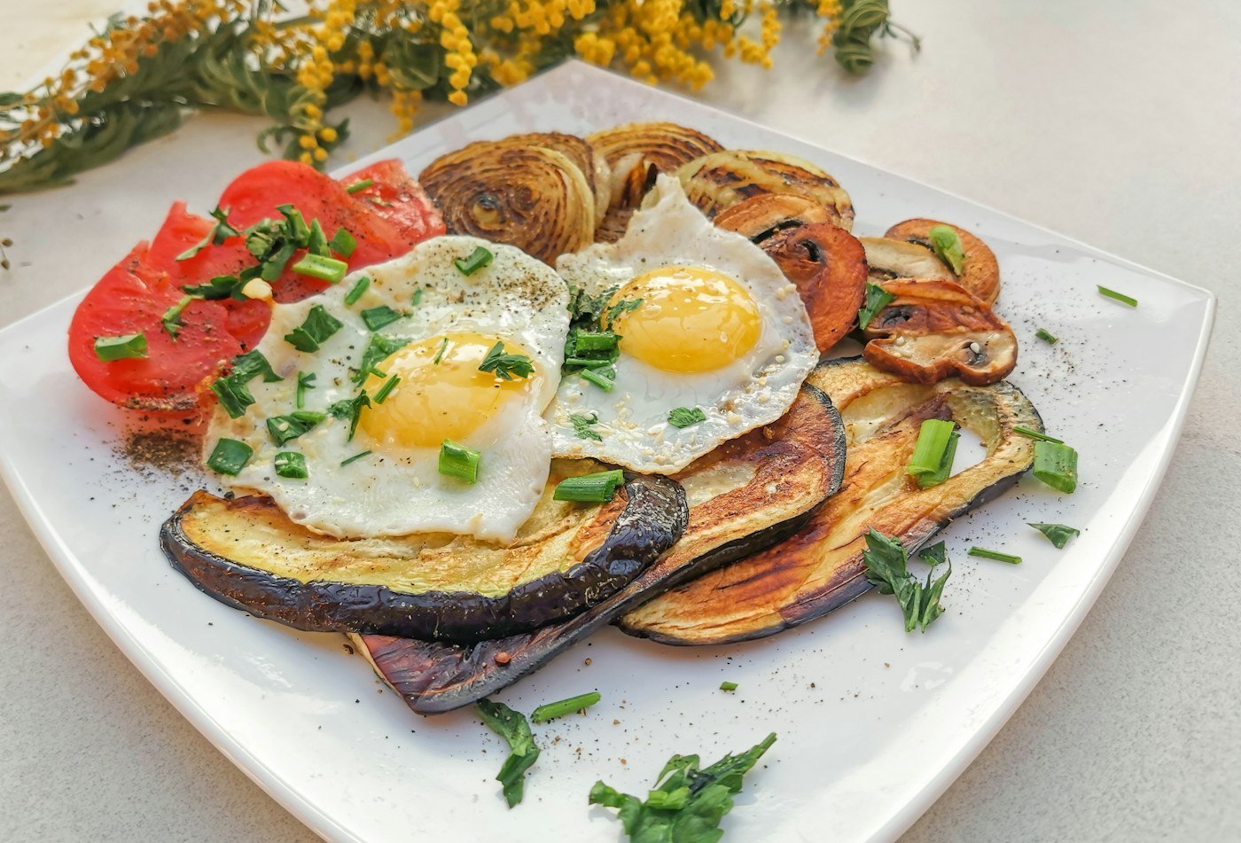 Fried eggs and vegetables served for breakfast