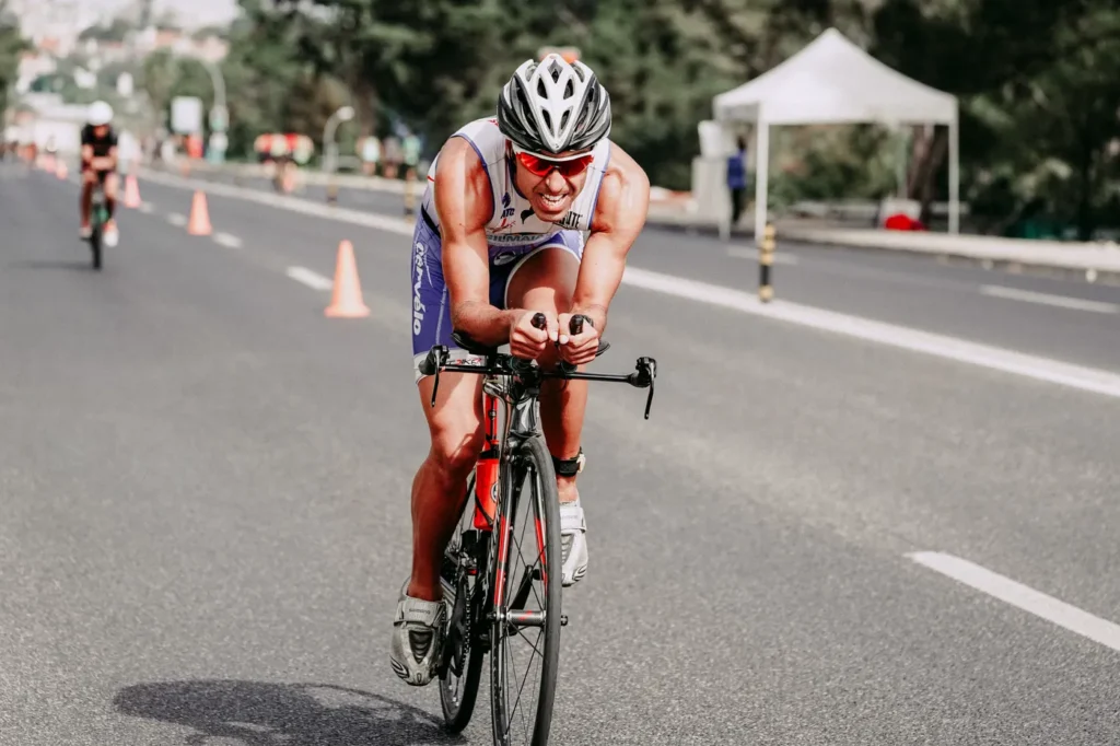 Road cyclist accelerating during a high-effort ride
