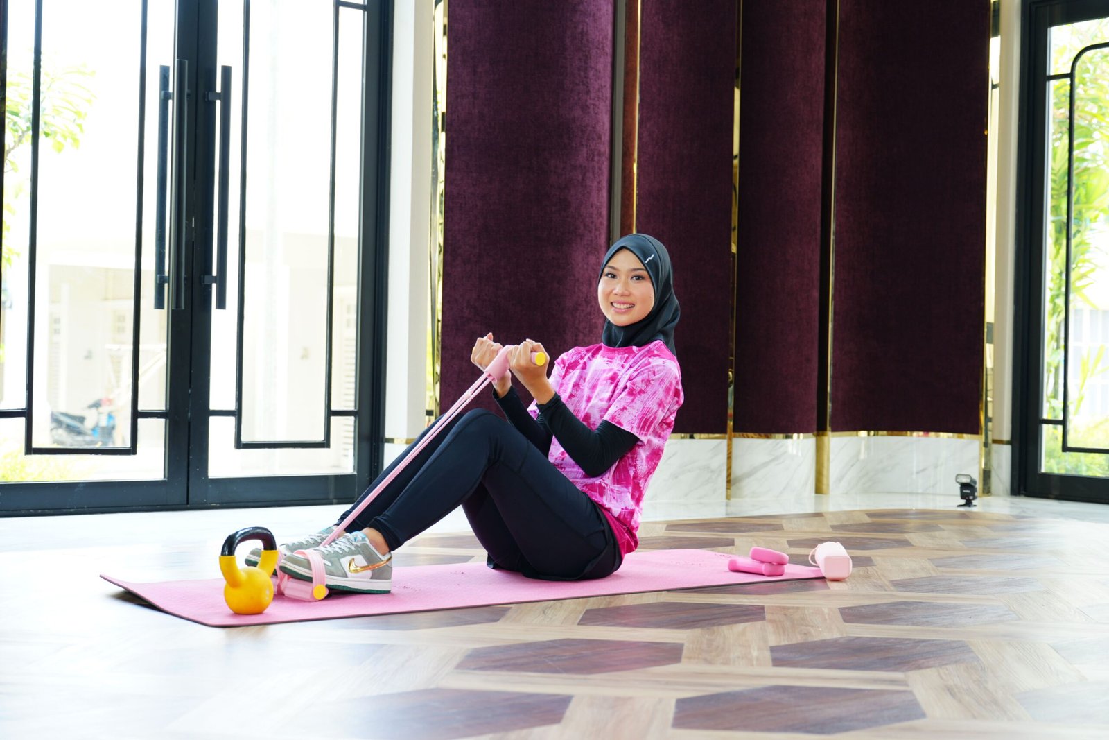 Woman using a resistance band for an exercise progression