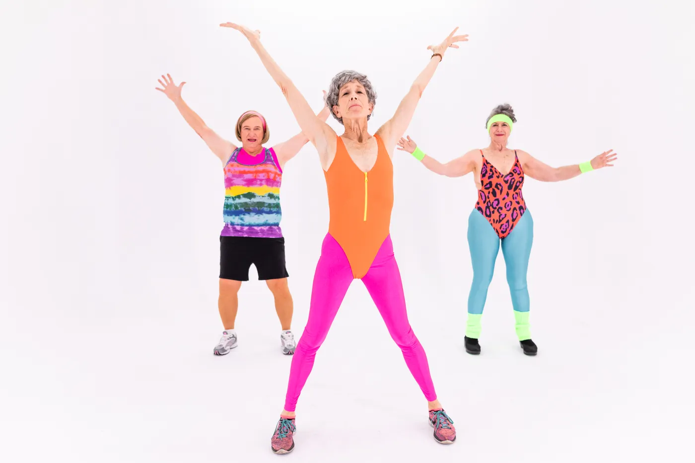Three older women taking part in a supervised group exercise session