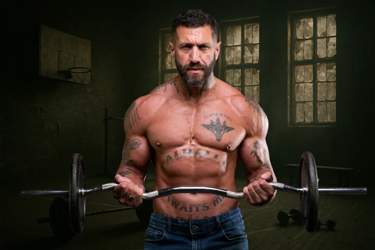Man performing dumbbell biceps curls during resistance training