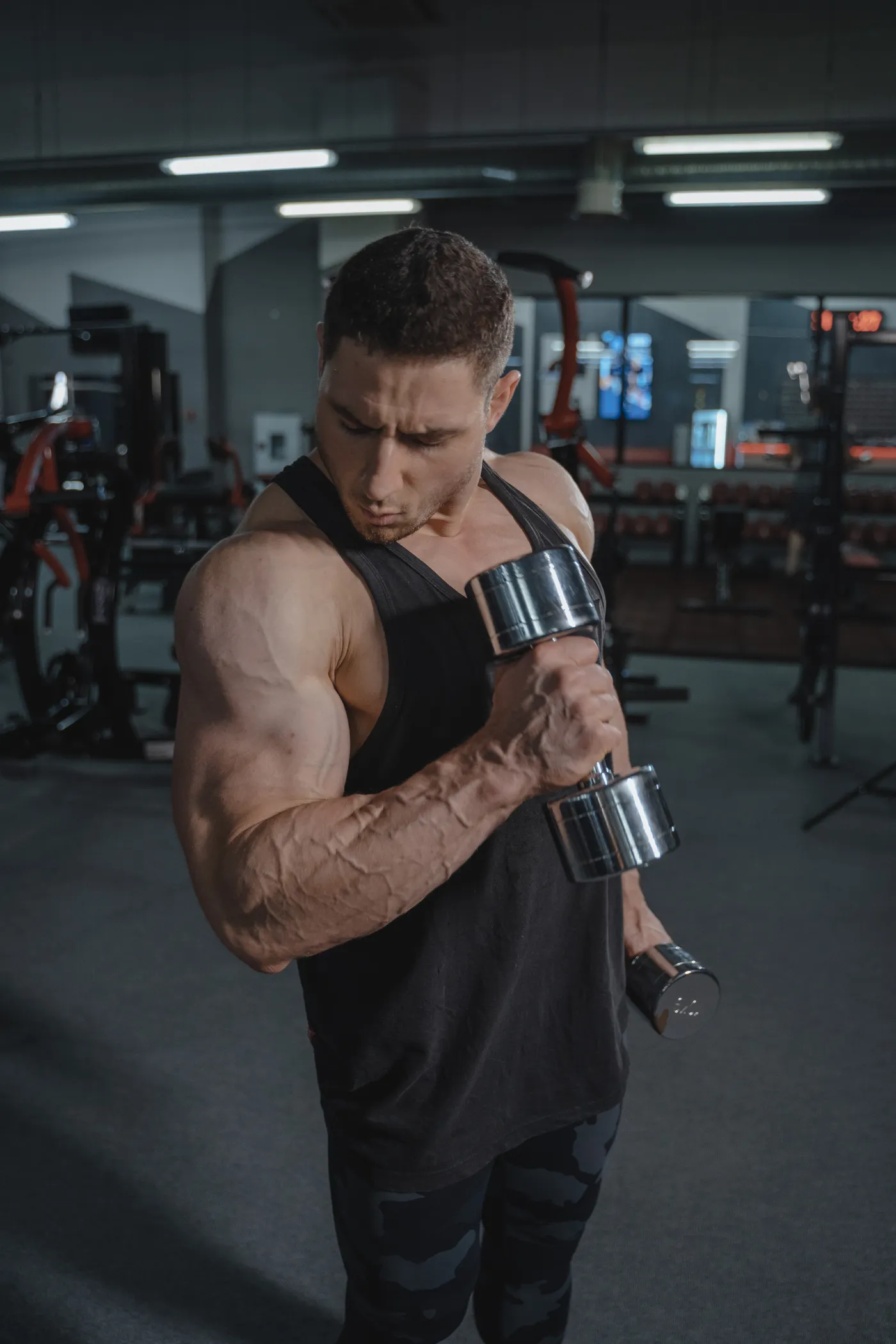 Man lifting dumbbells during a strength workout