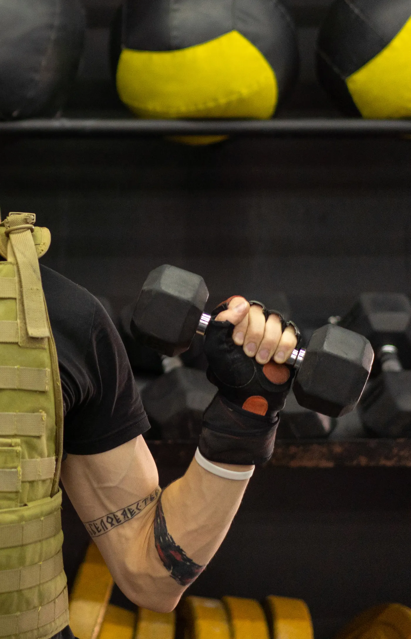 Person wearing a weighted vest during a gym workout