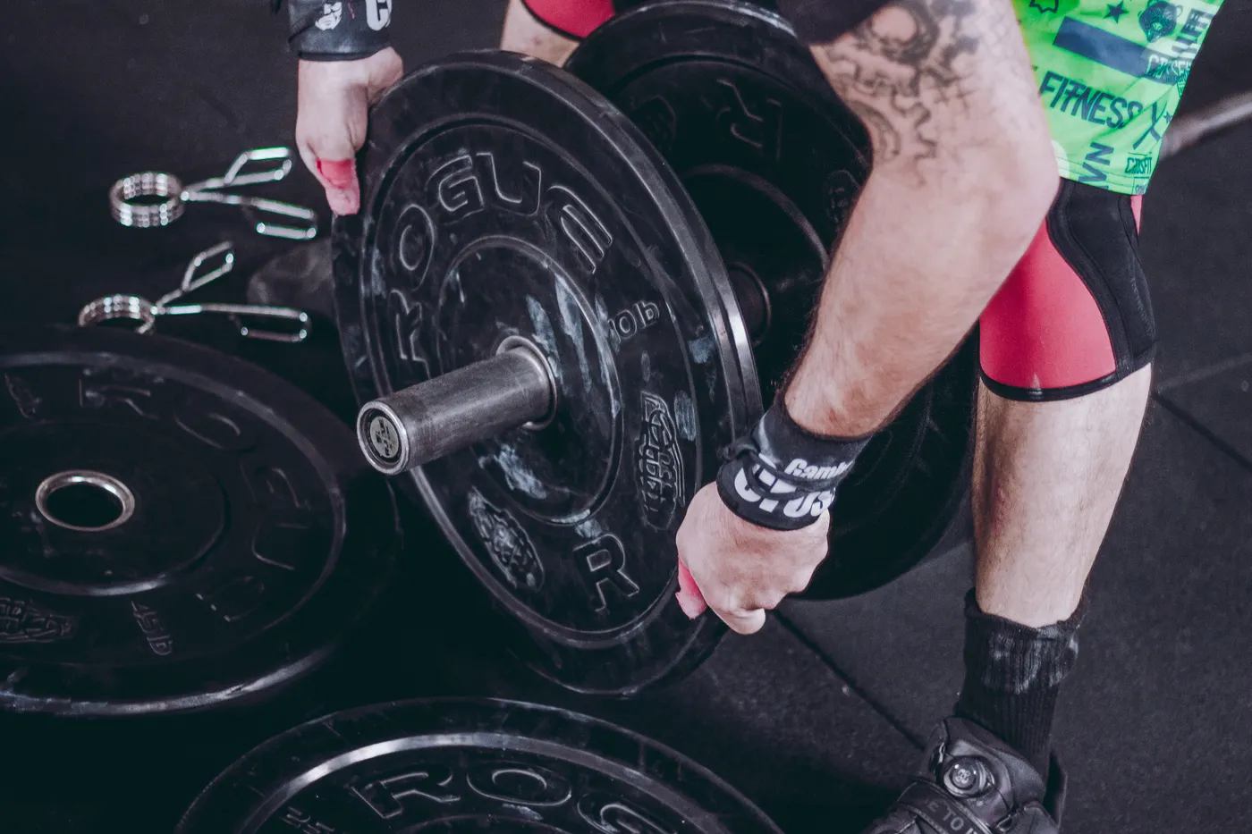 Close view of an athlete gripping a loaded barbell