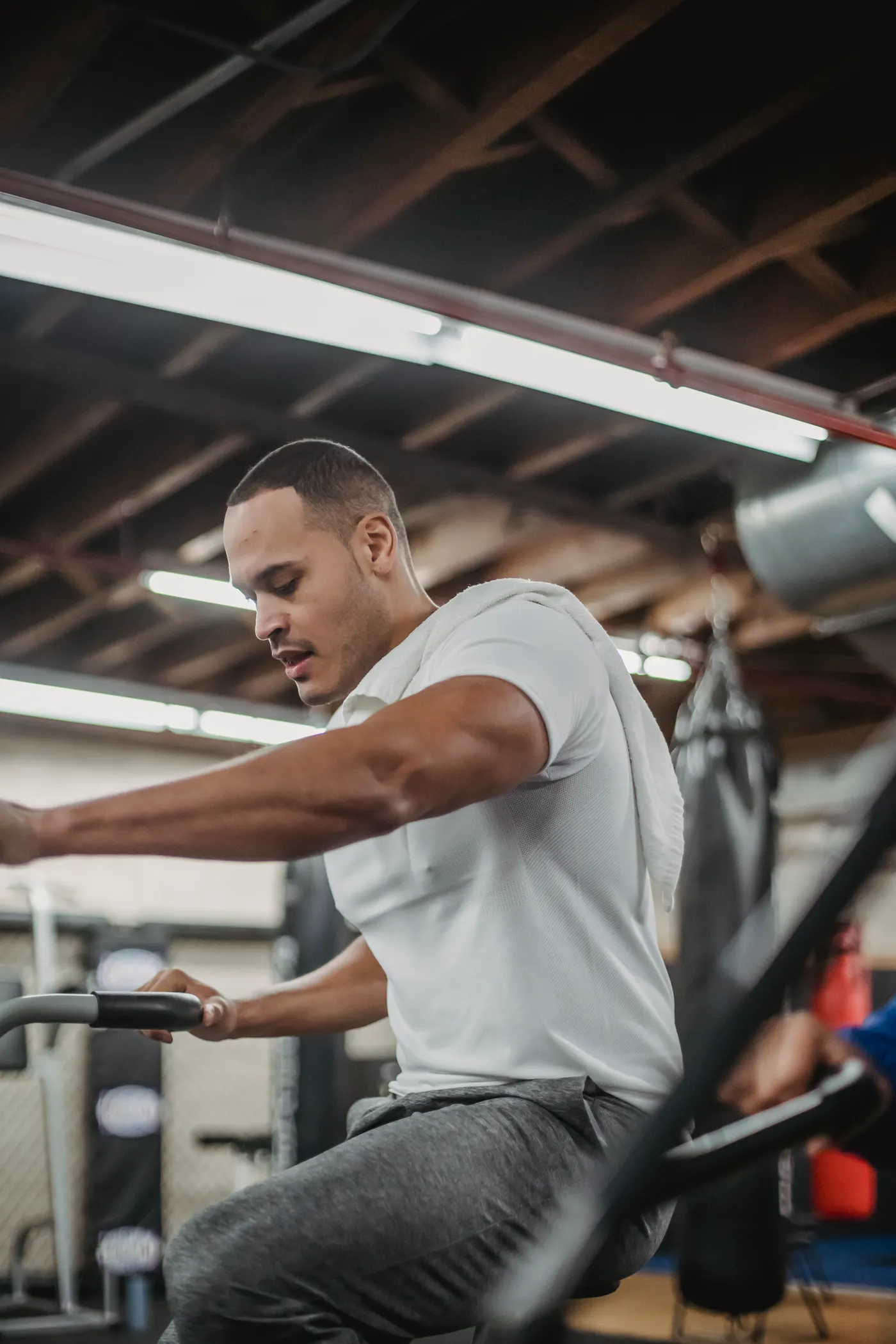 Athlete cycling on a stationary bike during indoor training
