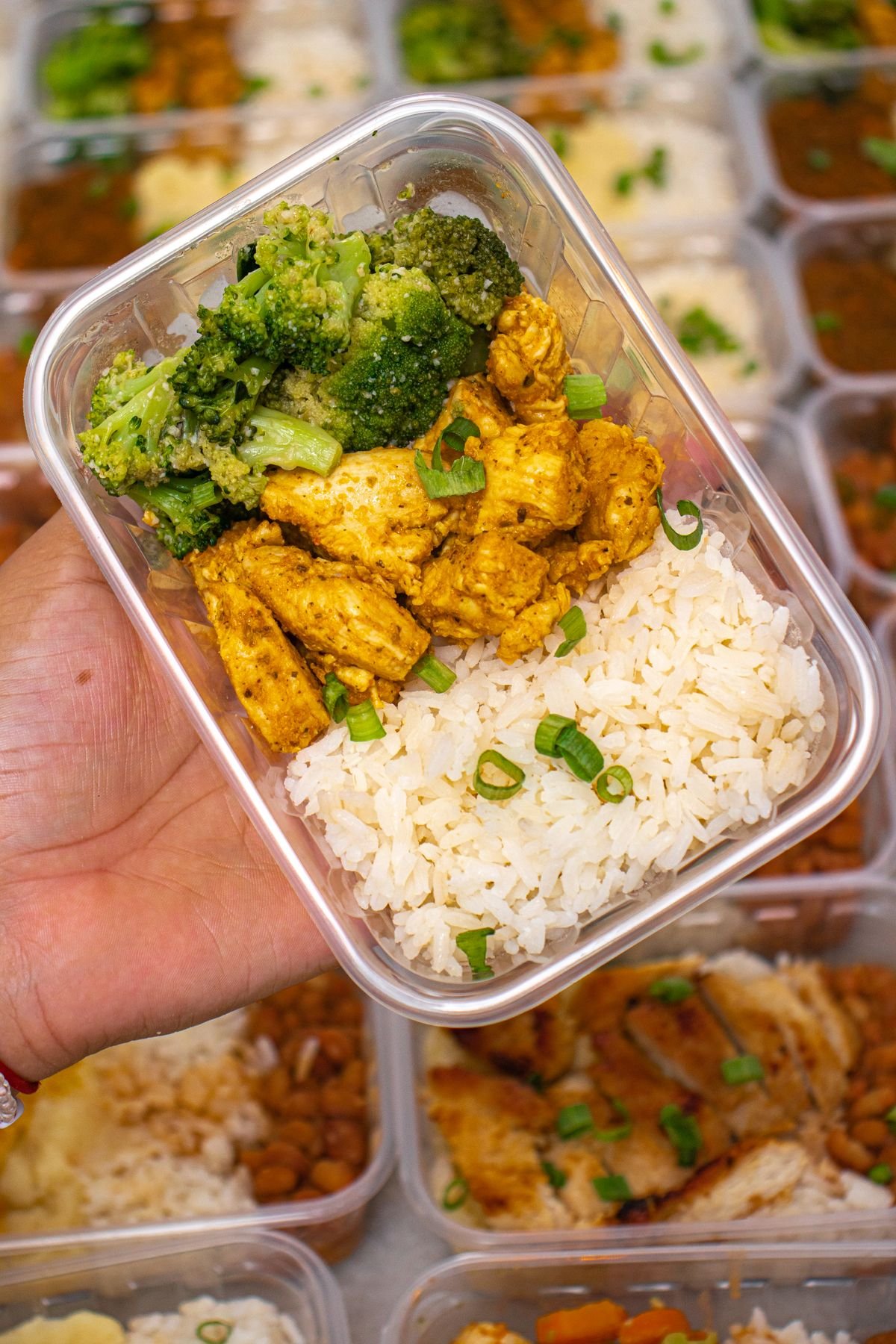 Prepared meal with chicken, broccoli and rice