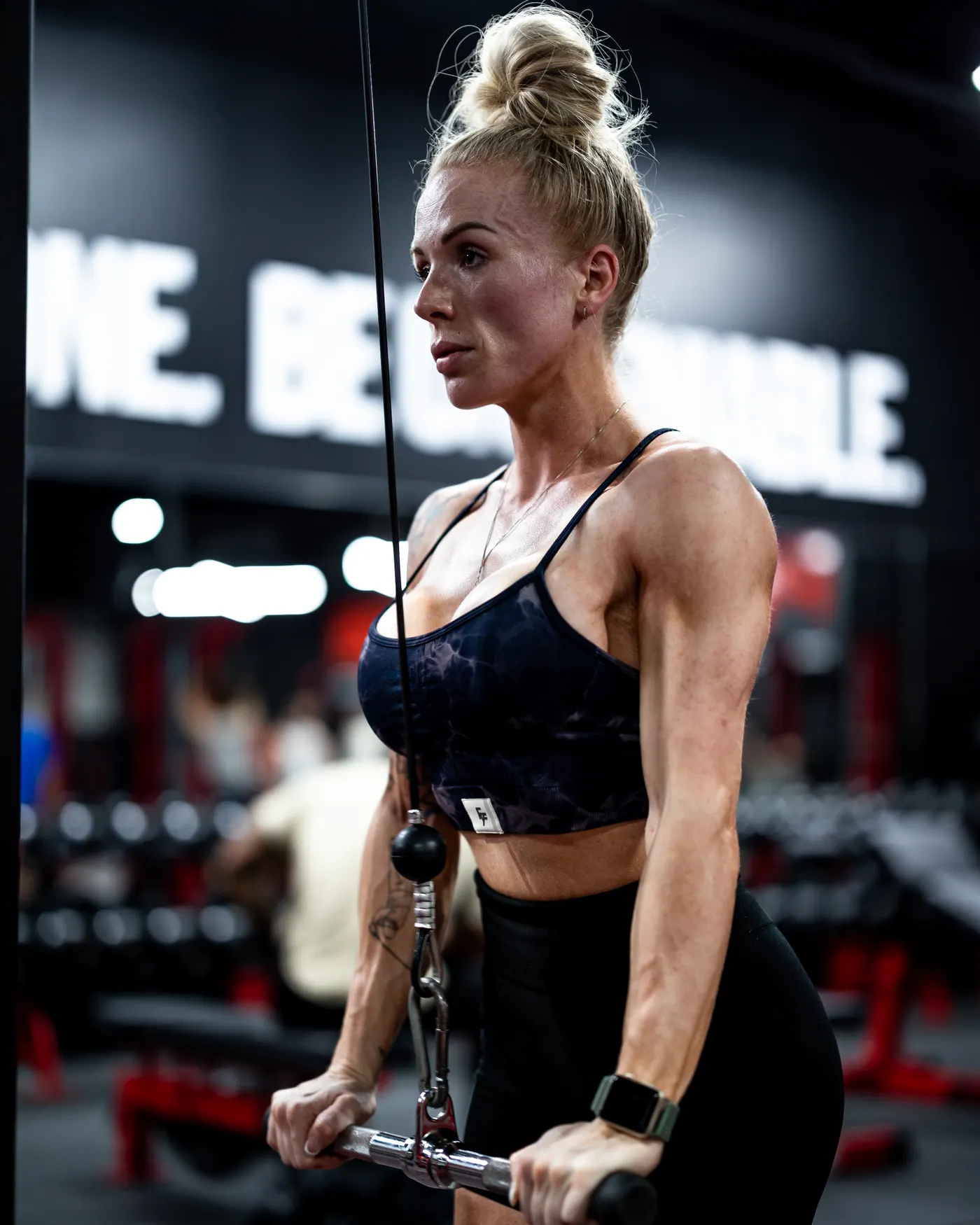 Woman performing controlled cable-machine training