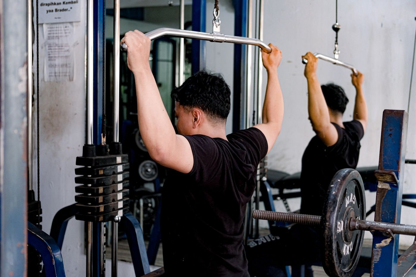 Athlete using a lat pulldown machine for back training