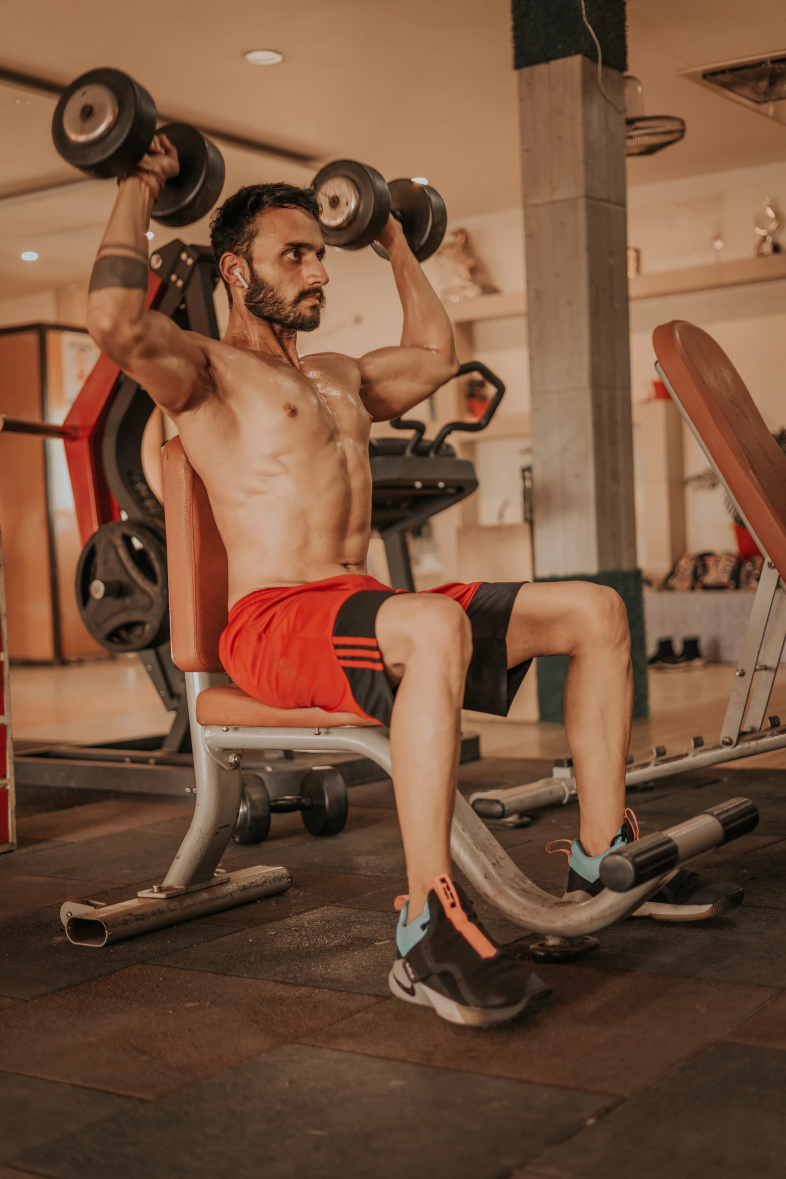 Athlete performing a barbell bench press during resistance training