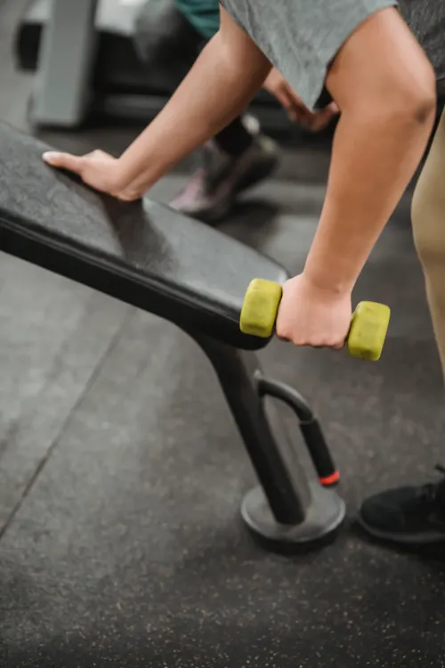 Woman holding a dumbbell during a strength workout