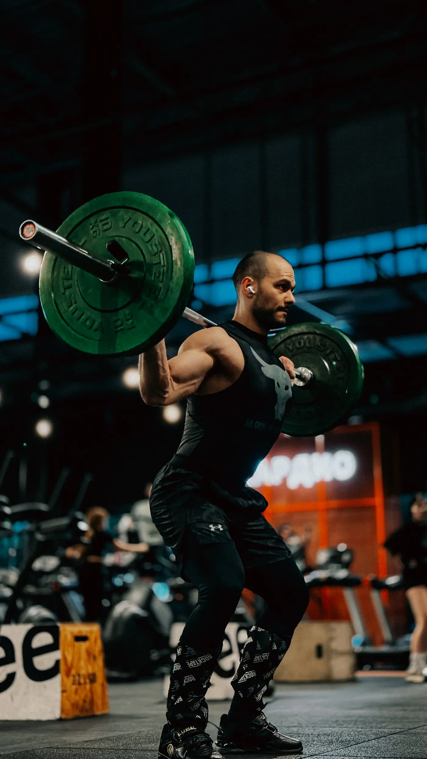 Athlete performing a loaded squat during strength training