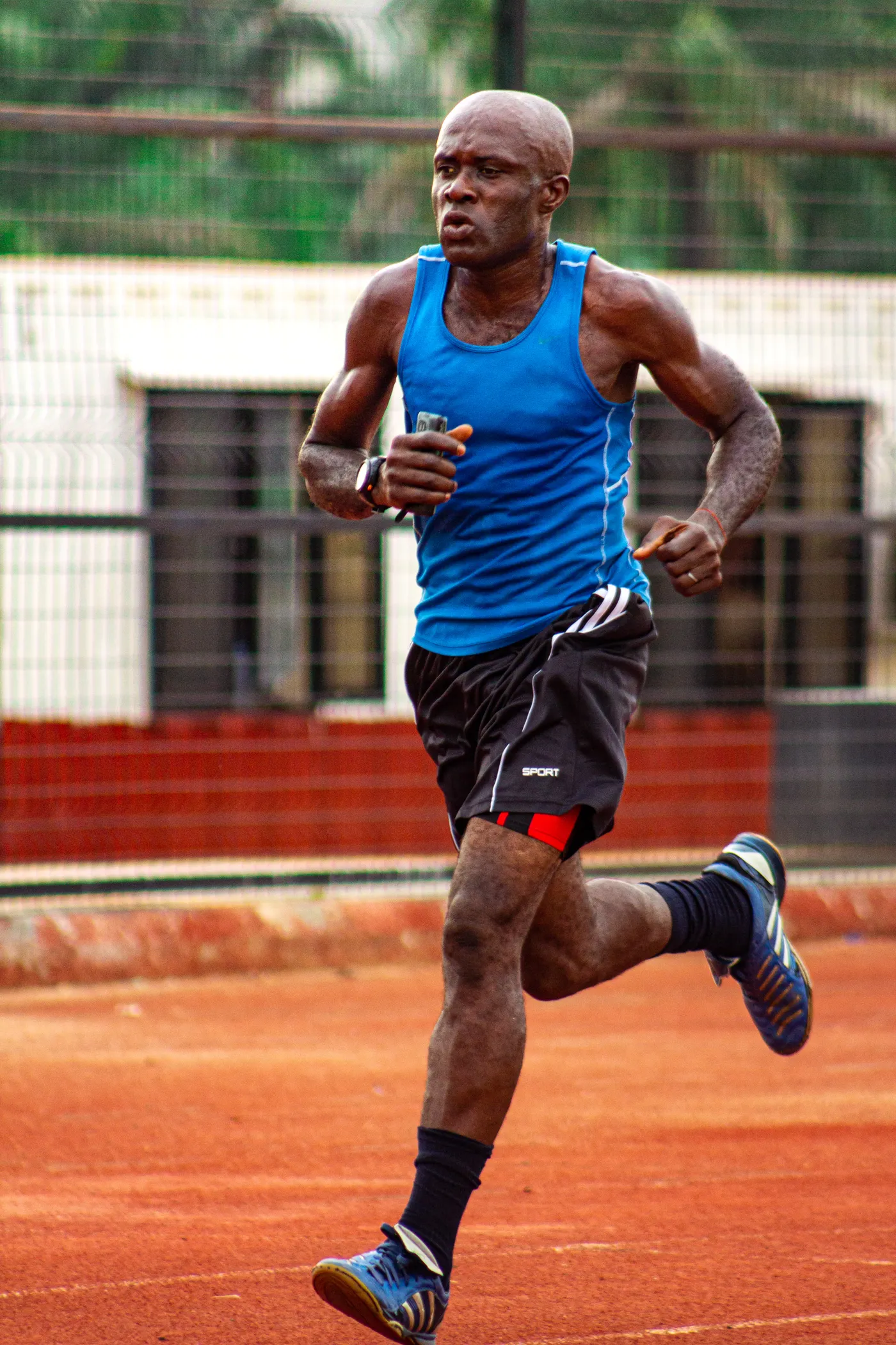 Runner moving along an outdoor track during training
