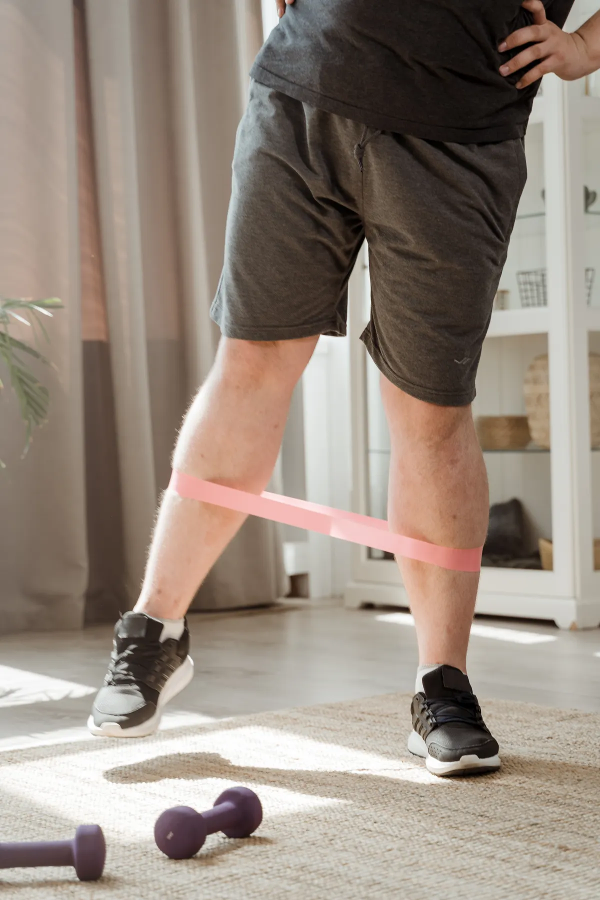 Athlete performing a lower-body exercise with a resistance band