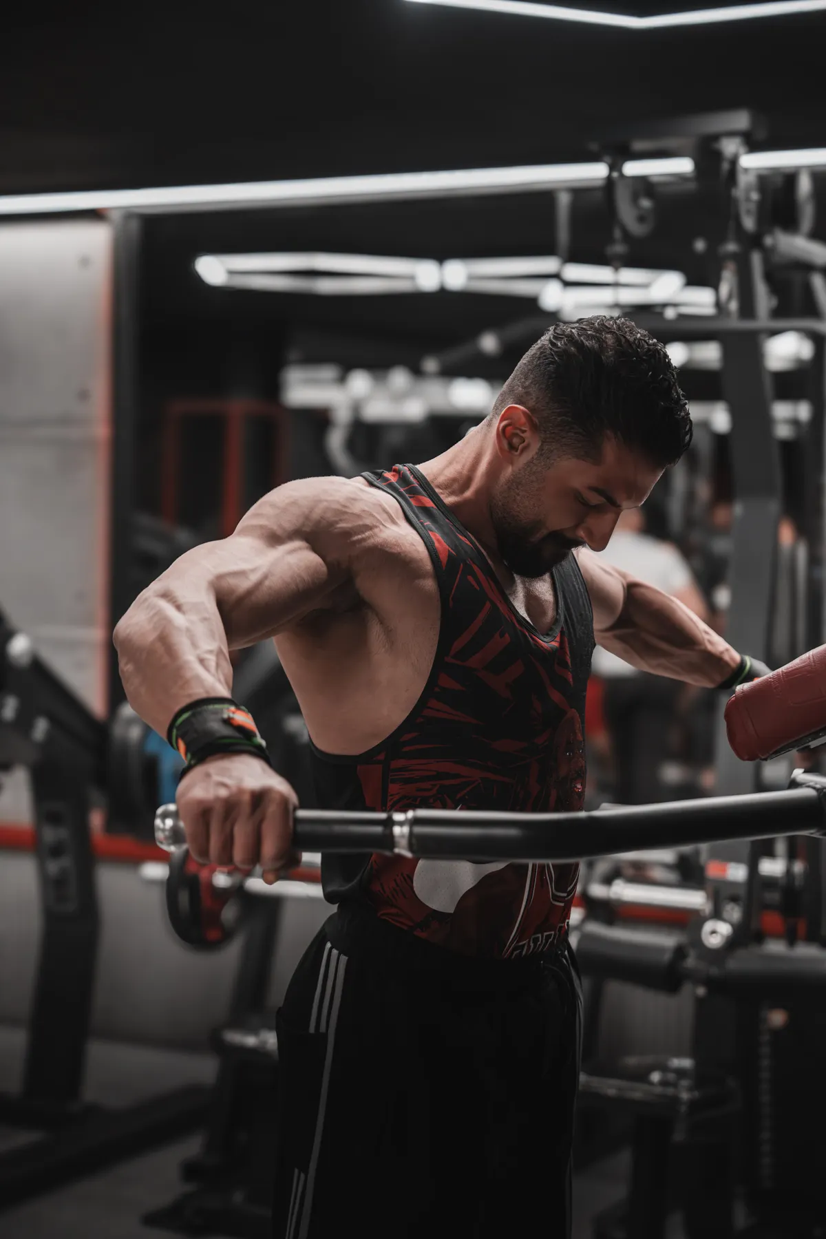 Lifter performing a lat pulldown with an overhead bar