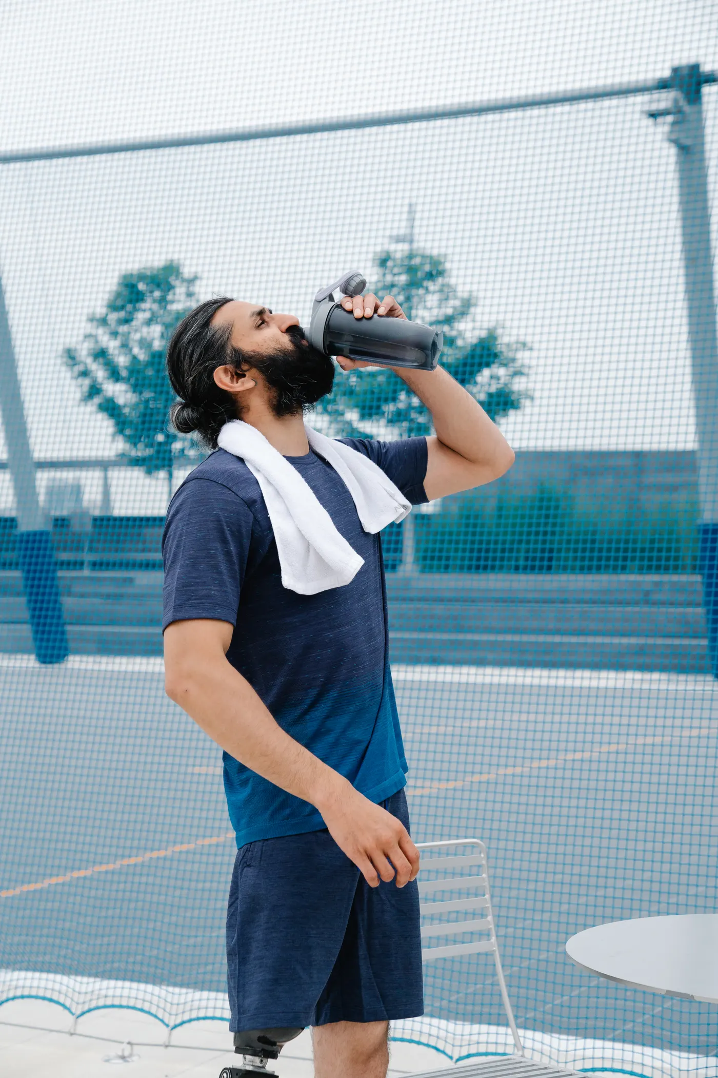 Athlete drinking water after an outdoor workout