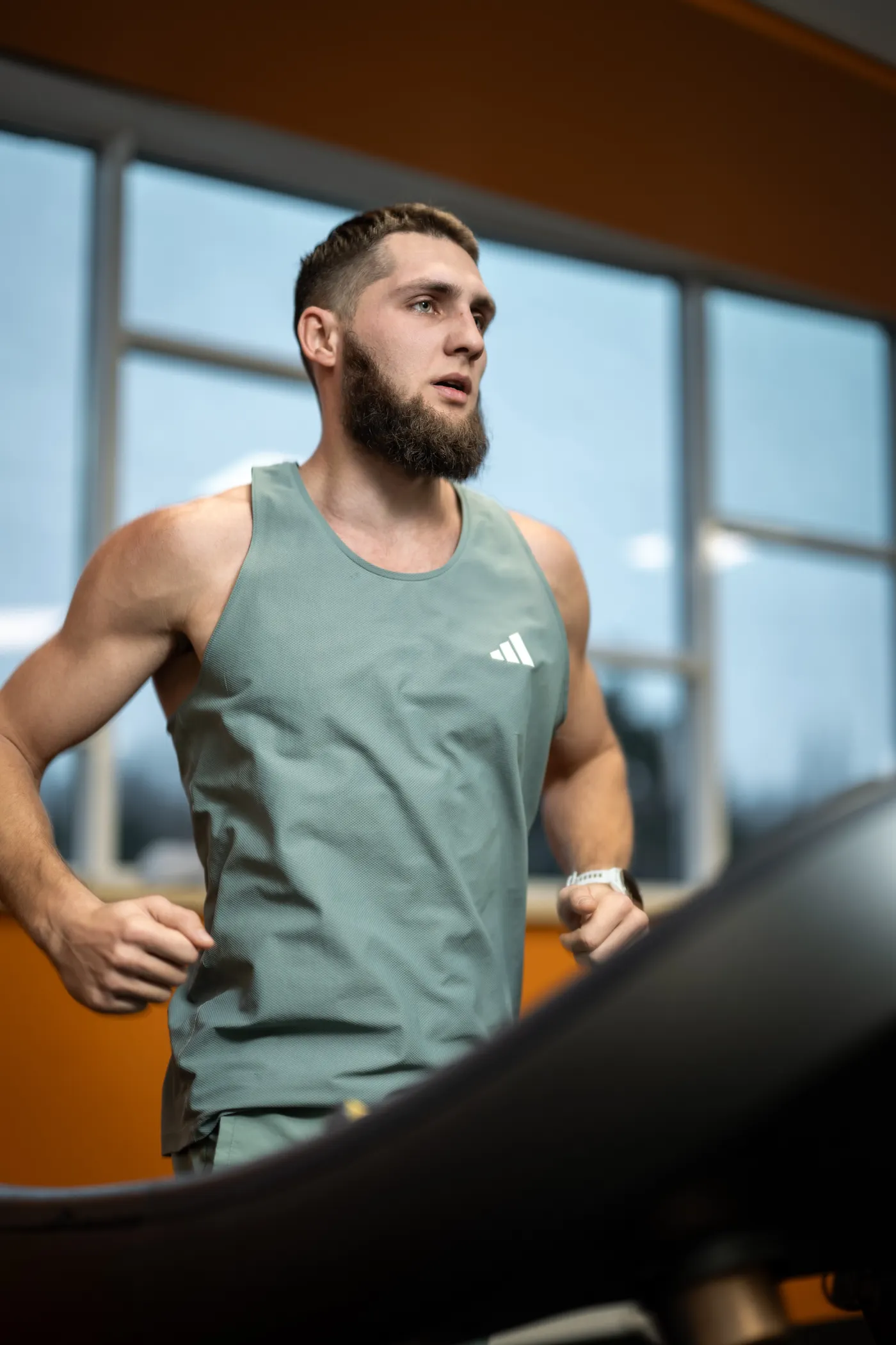 Athlete training on a treadmill indoors