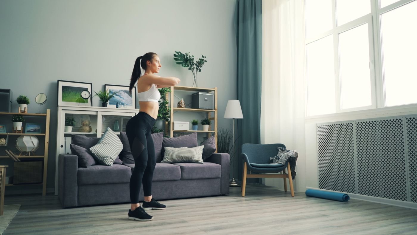 Woman exercising in a living room