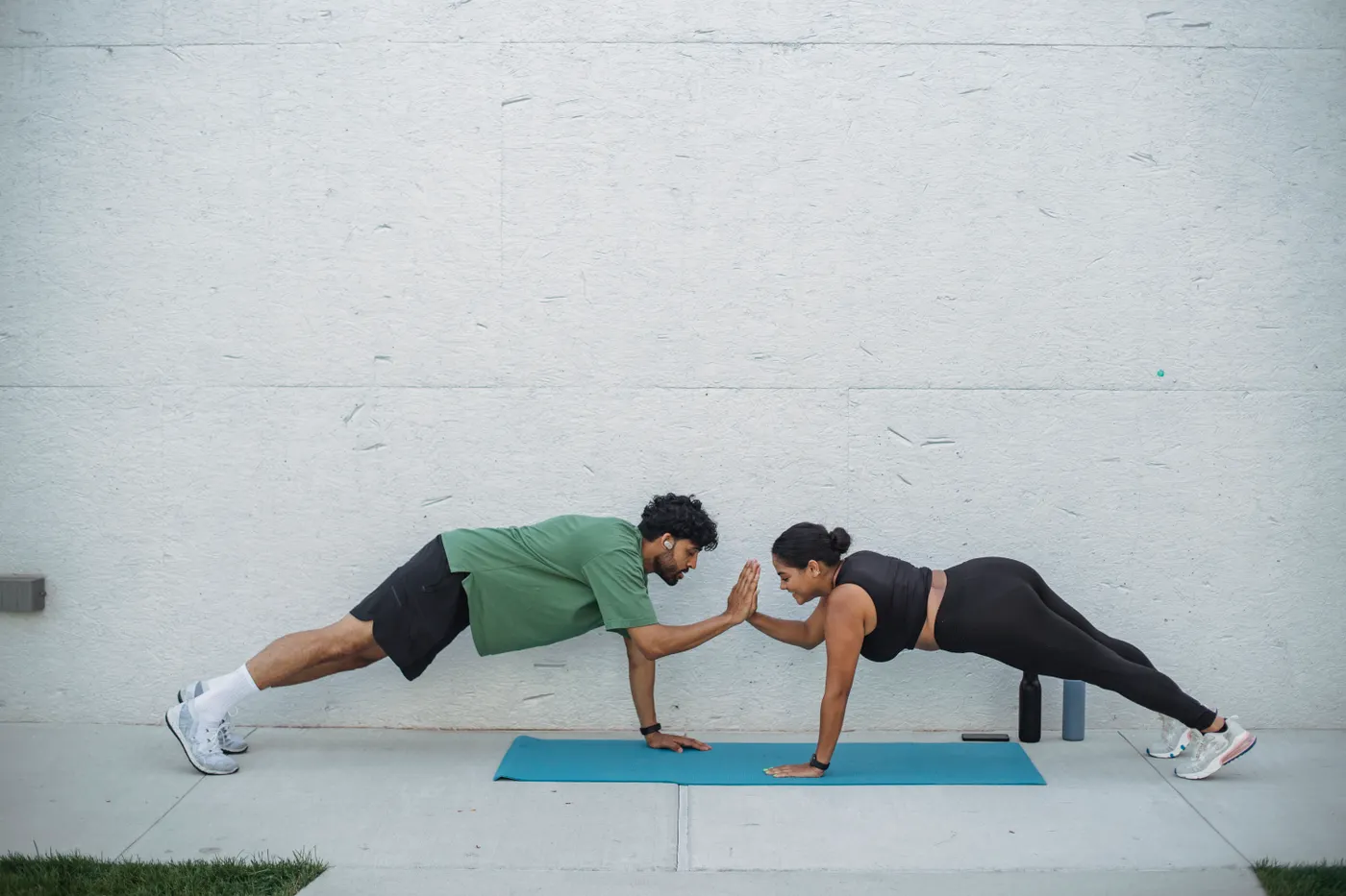 Two people doing planks