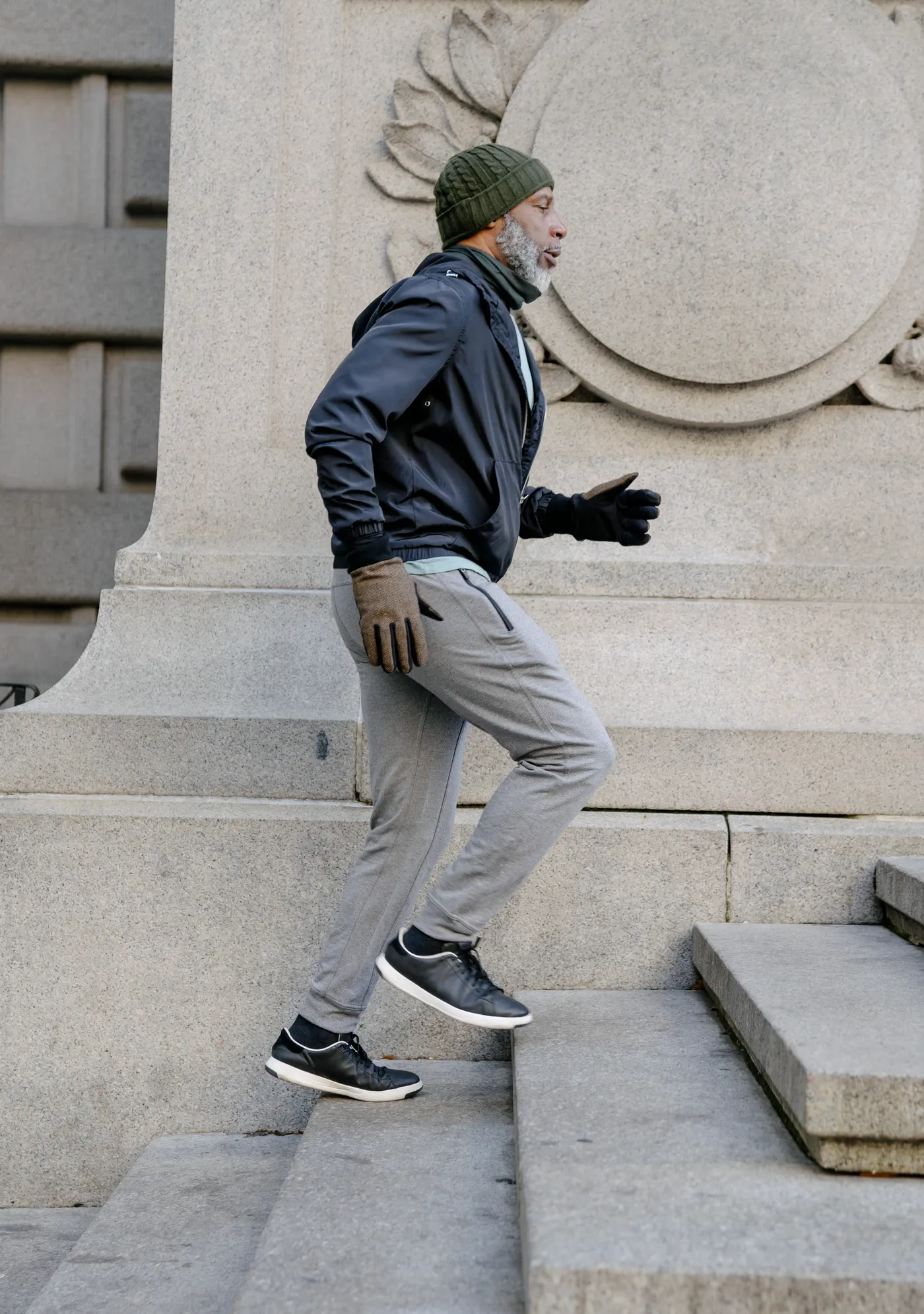 Active senior man ascending outdoor stairs