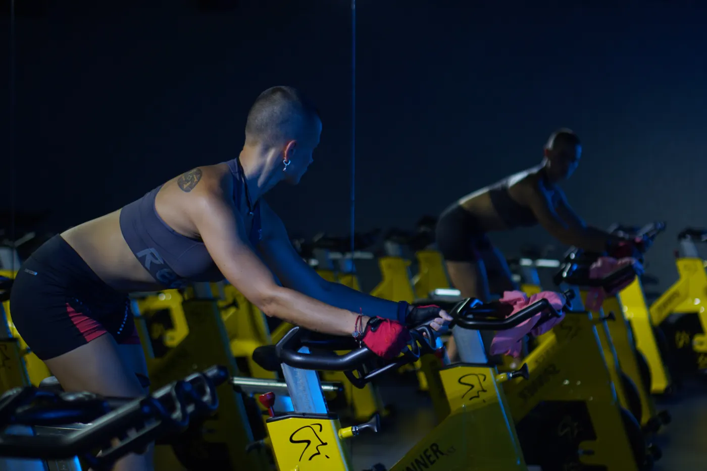 Woman training on a stationary exercise bike indoors