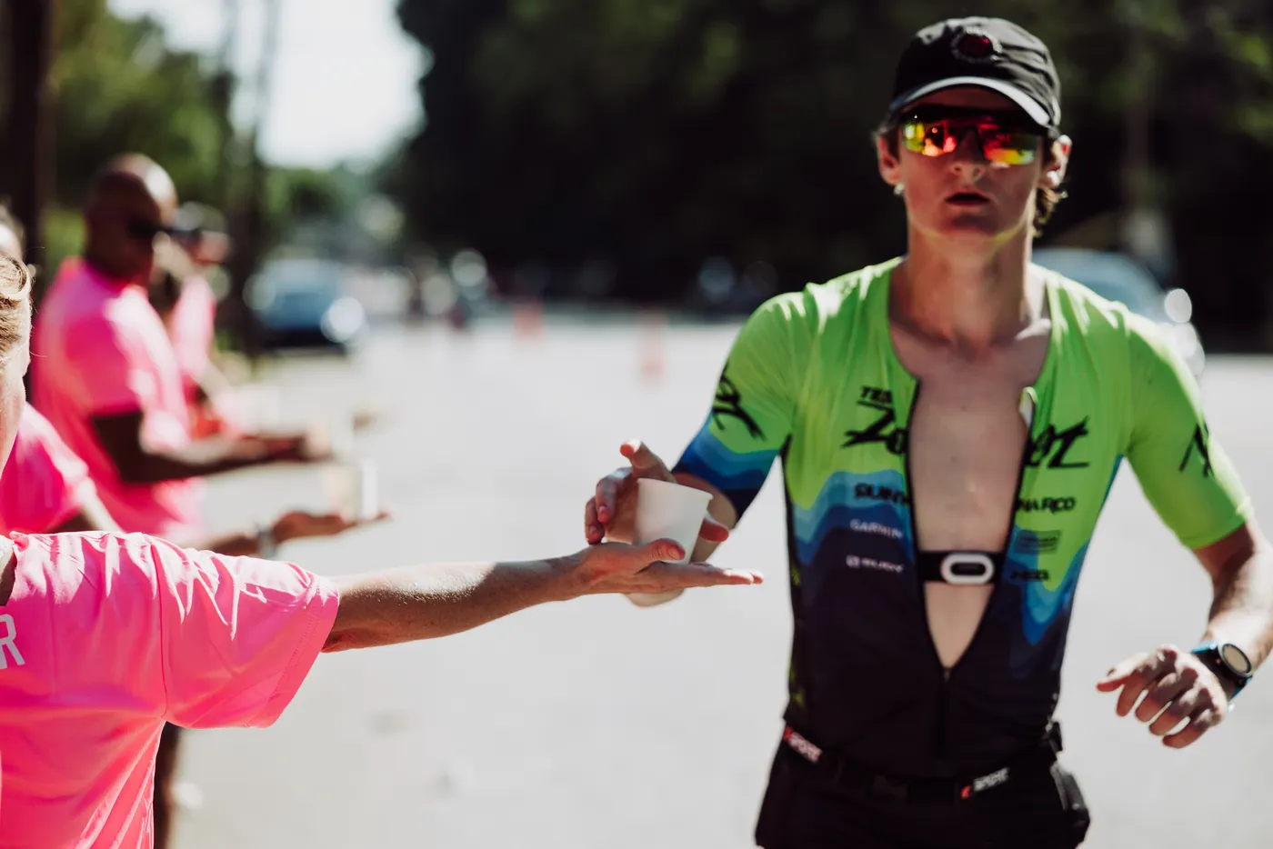 Runner receiving drinking water during a marathon event