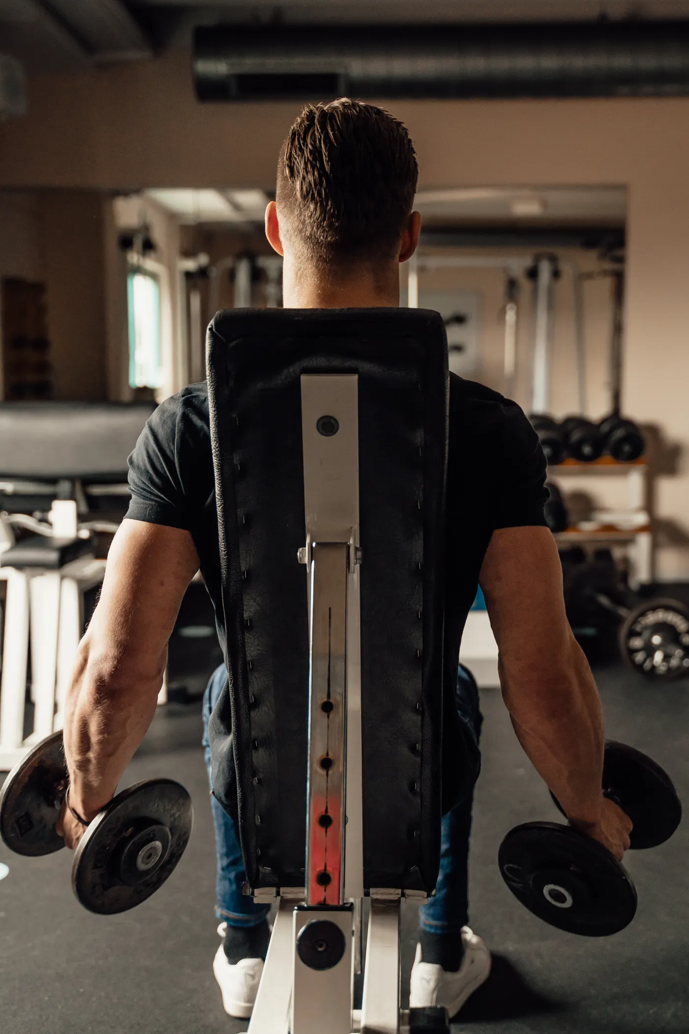 Athlete performing a dumbbell strength exercise