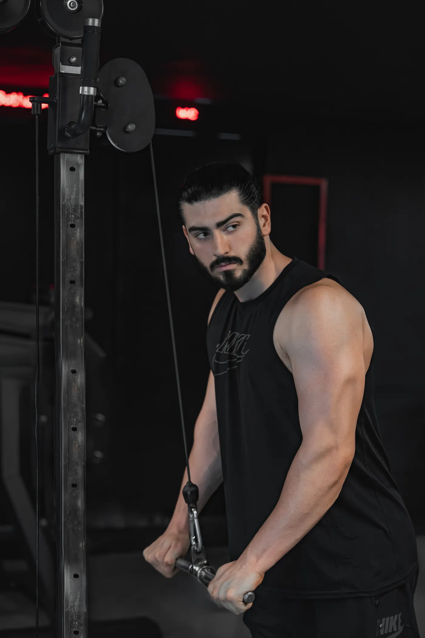 Athlete training on a cable resistance machine