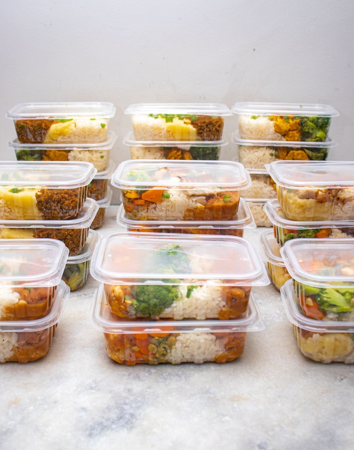 Prepared meals with rice and vegetables in food containers