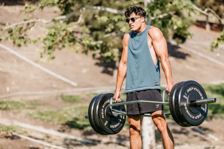 Athlete gripping a barbell during a strength-training session