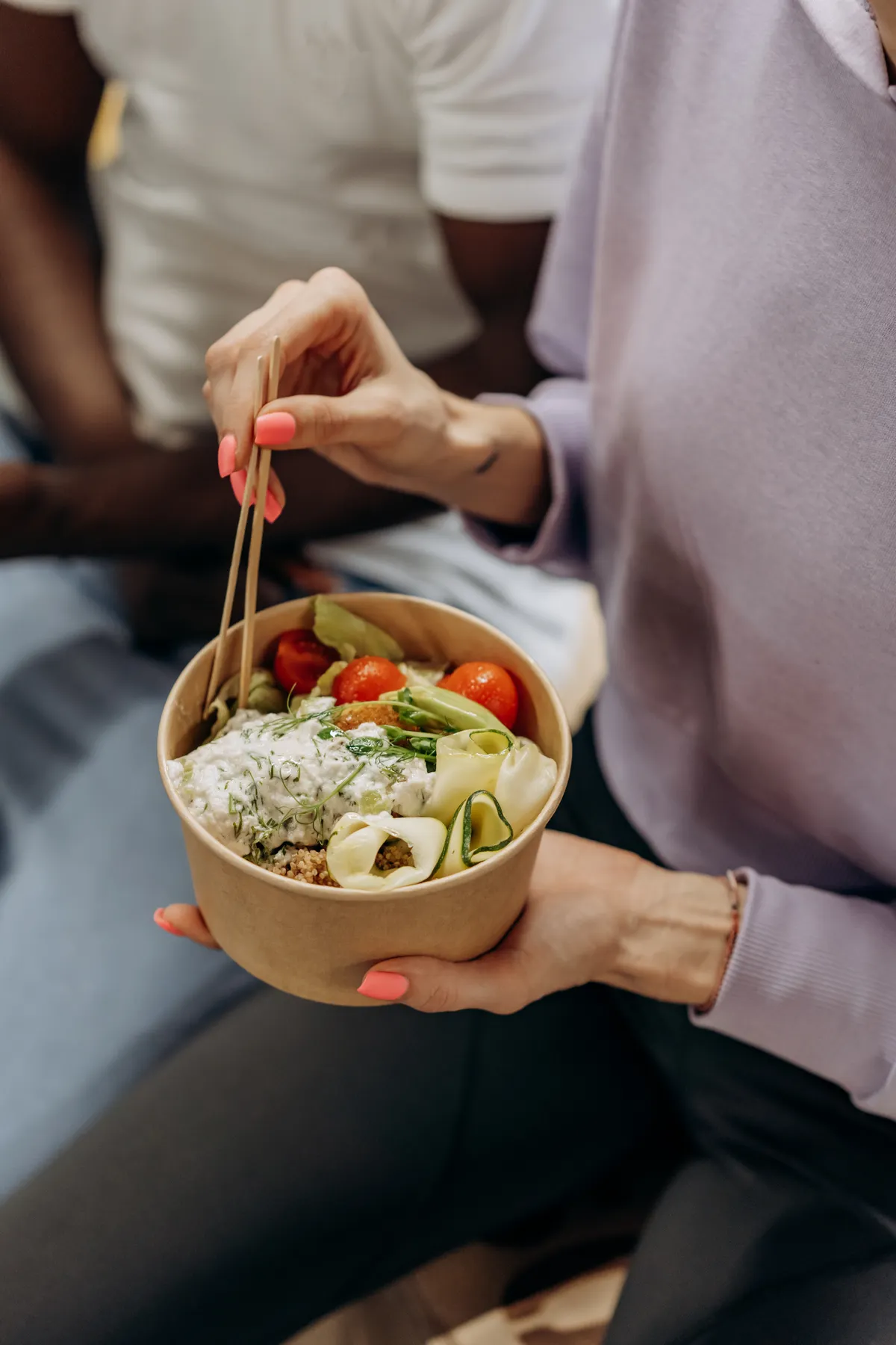 Woman eating a nutritious meal while seated at a table