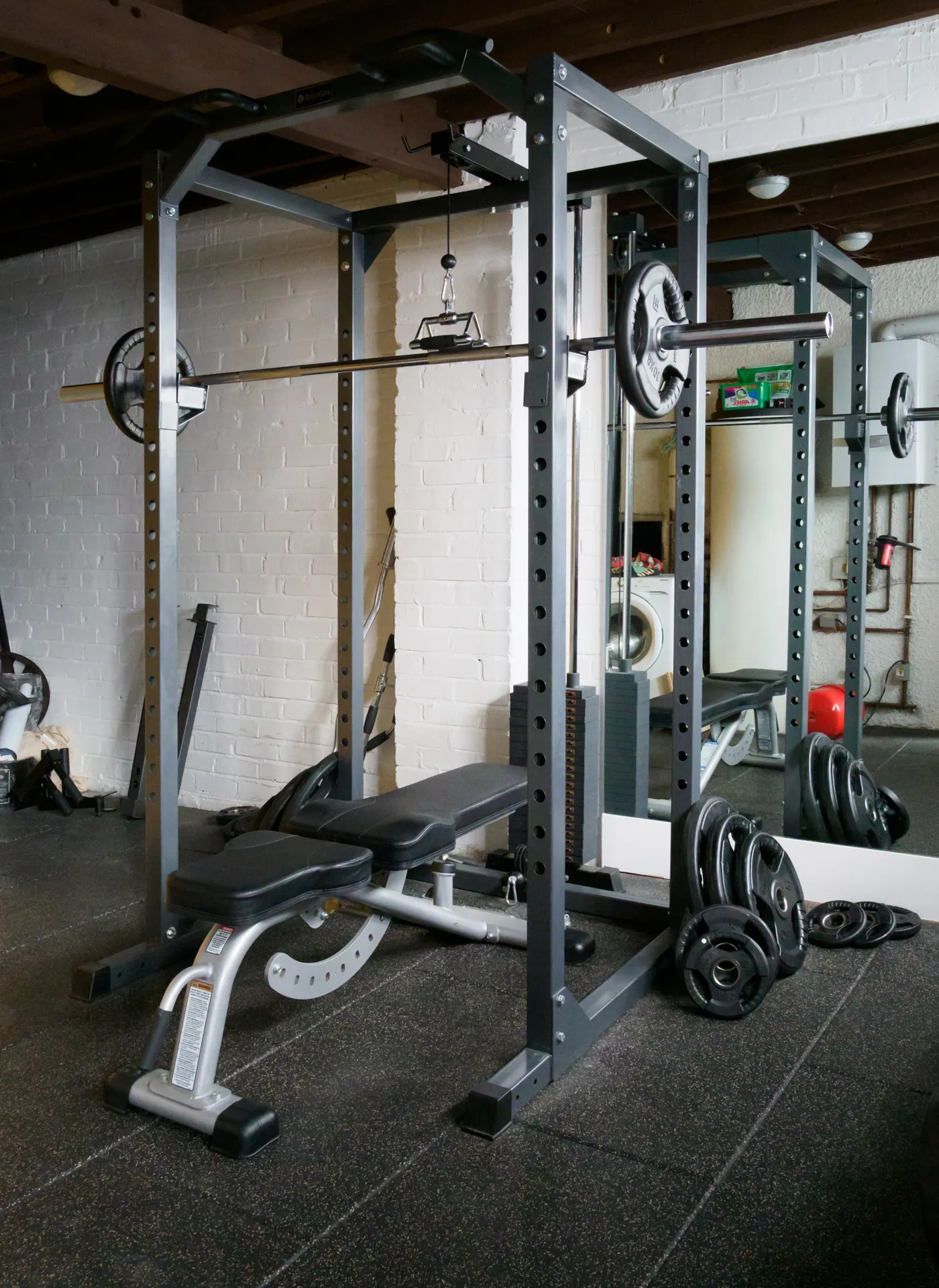 Weight bench and barbell setup in a dedicated training space