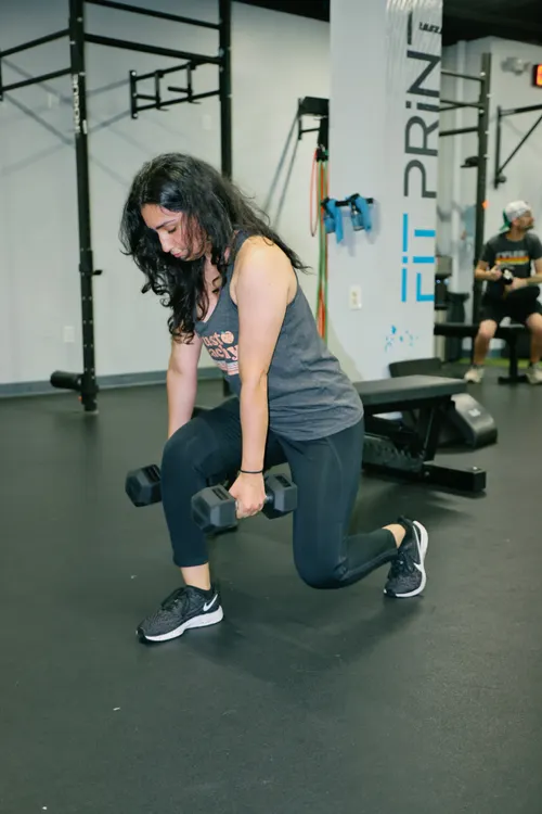 Athlete performing loaded lunges as part of a strength session