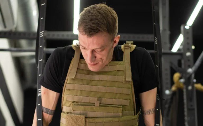 Athlete wearing a weighted vest during indoor fitness training