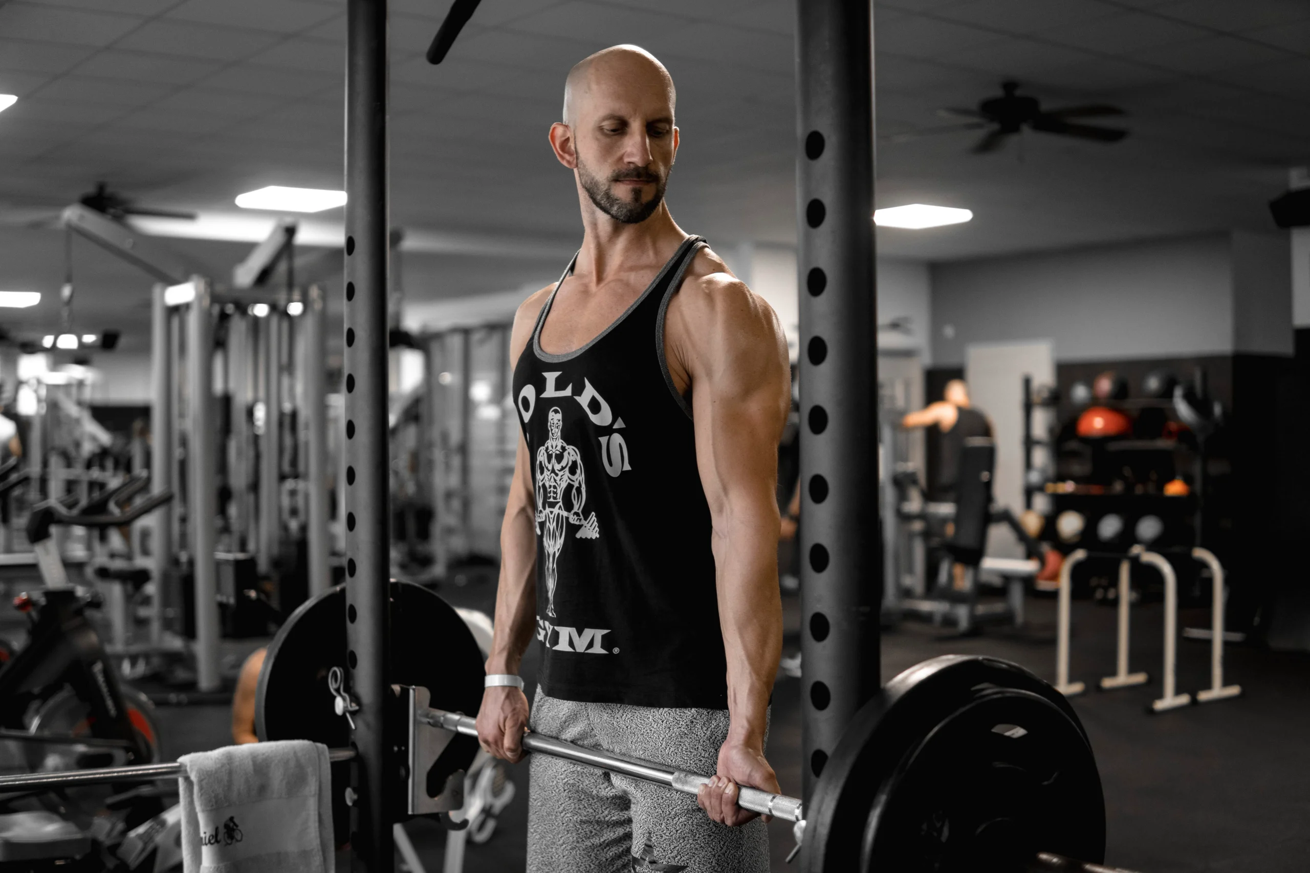 Lifter training with a barbell in a gym