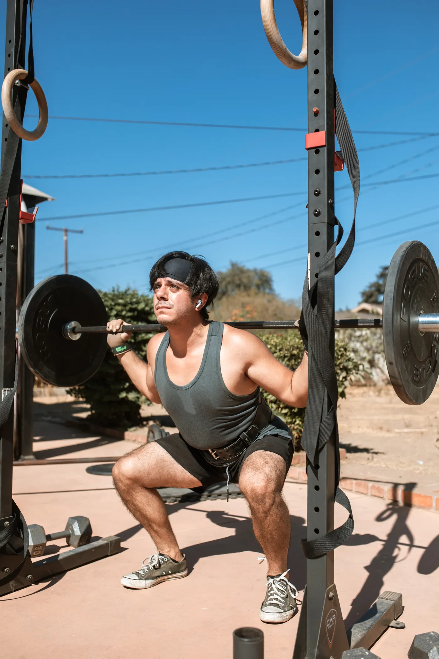 Athlete performing a controlled barbell squat to develop lower-body force