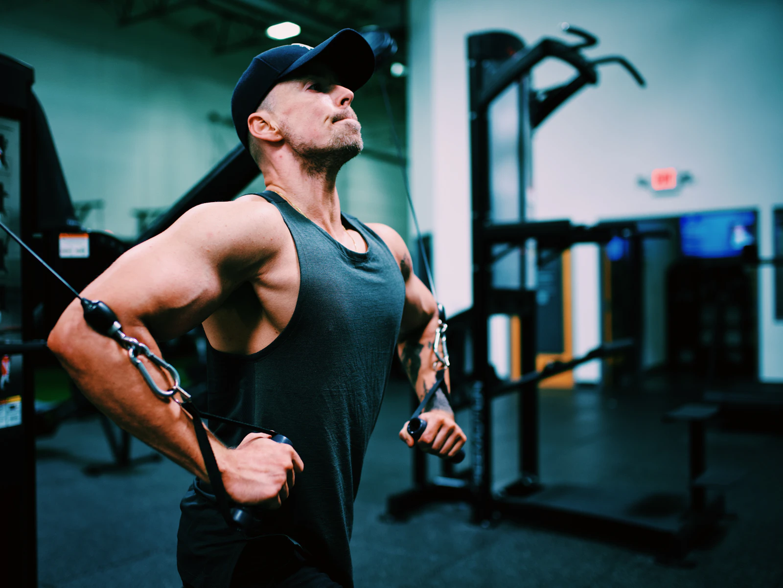 Athlete performing a standing cable fly on a functional trainer