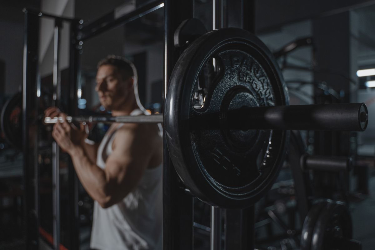Lifter working with a loaded barbell in the gym