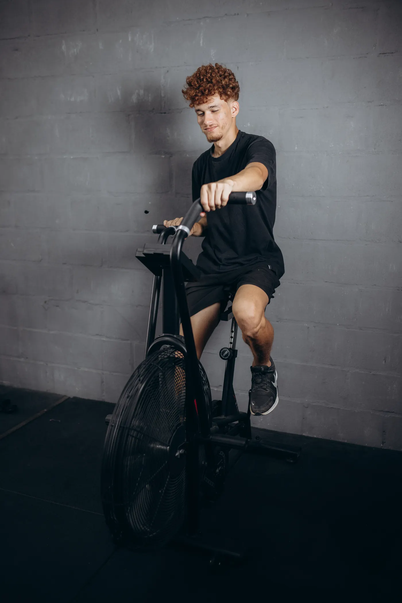 Athlete cycling on a stationary exercise bike