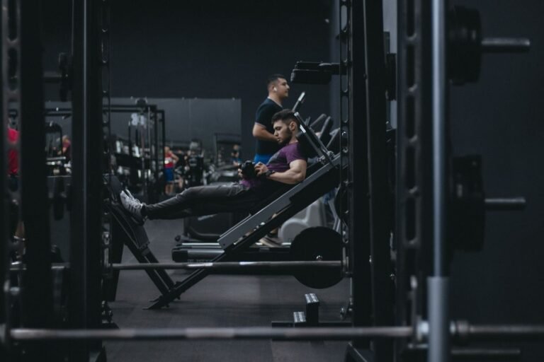 Athlete using a leg press machine during lower-body strength training