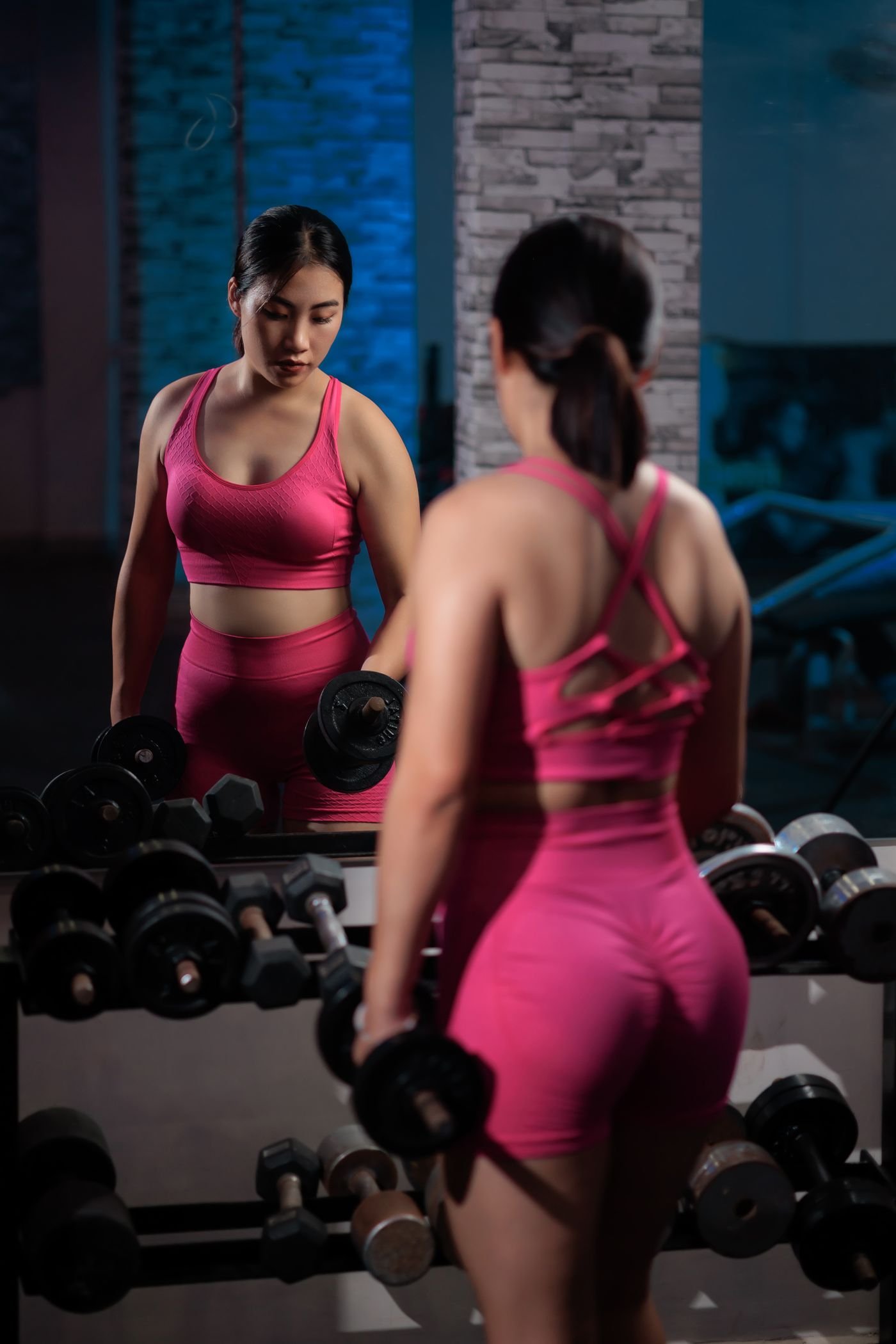 Woman performing dumbbell resistance training