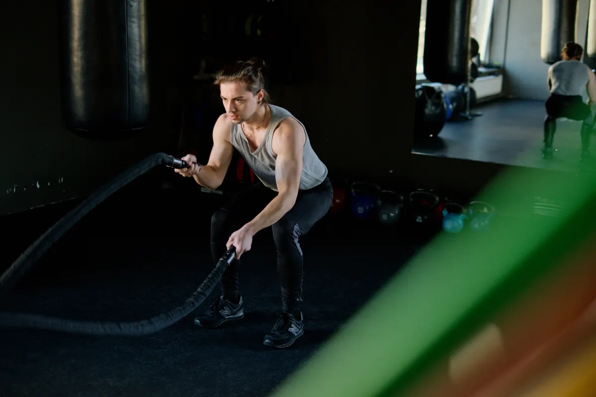 Man working through a battle-rope conditioning interval