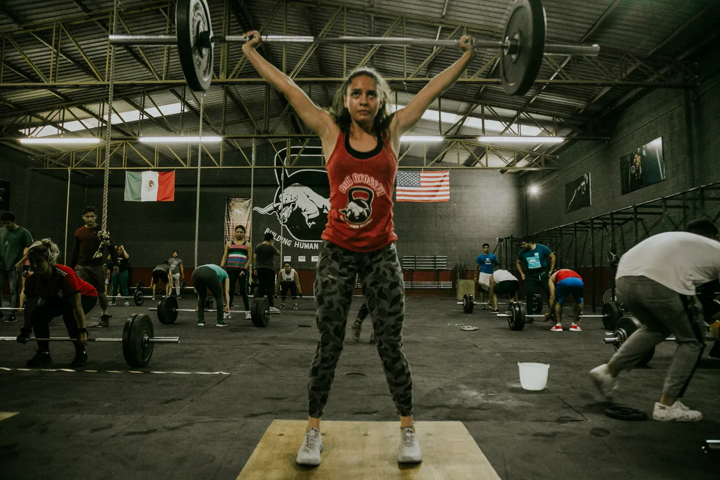 Group of athletes lifting weights during a strength training session